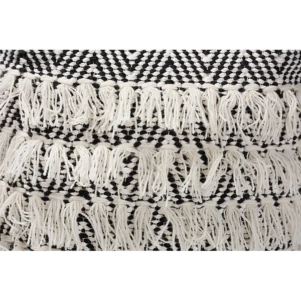 Baxton Studio Alain Moroccan Inspired Black and Ivory Handwoven Wool Tassel Pouf Ottoman
